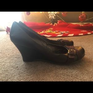 Brown leather platform heels by Aldo size 10.